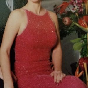 Beautifully beaded poppy colored evening dress